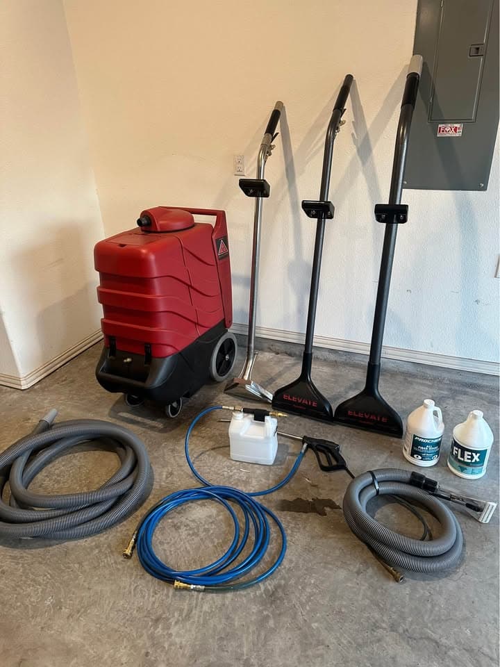 Full set of professional carpet cleaning equipment including extraction machine, wands, hoses and cleaning solution
